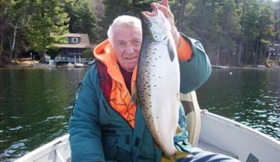 Man holding landlocked salmon